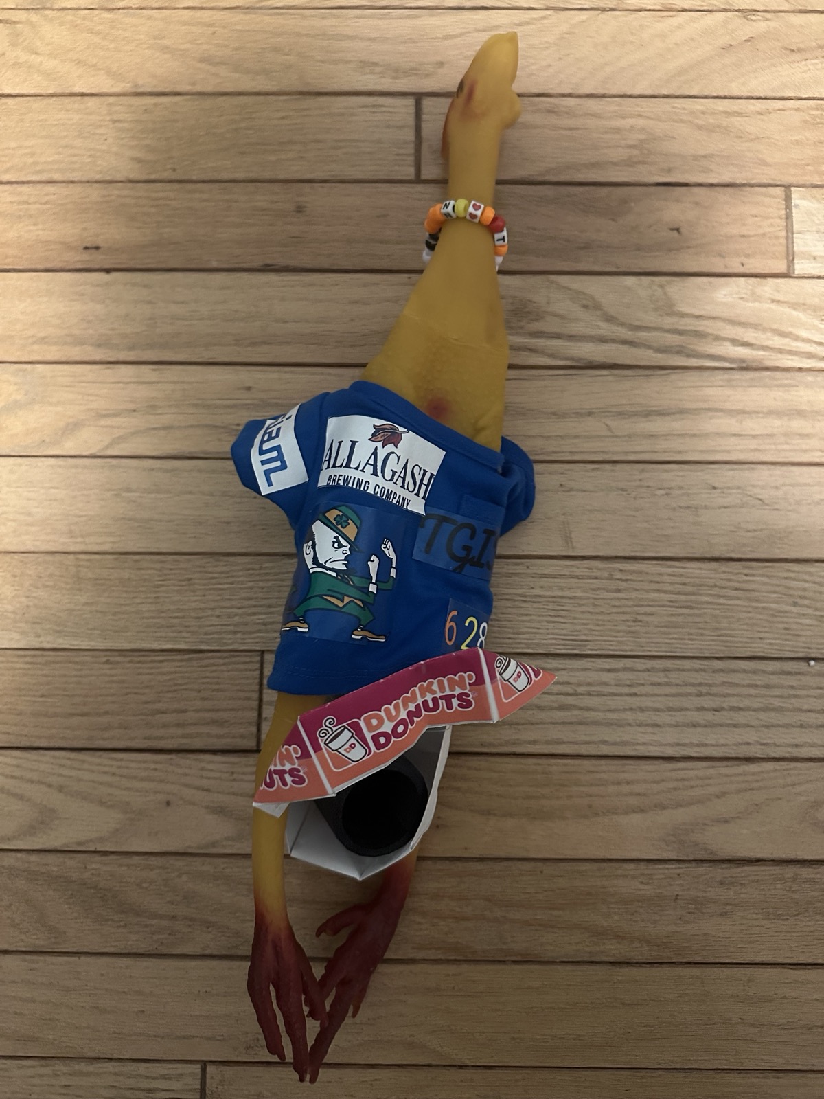 My dissertation chicken: Dunkin Donuts, a small 3D-printed mug, 2π, SIAM, Allagash, beads, Notre Dame&rsquo;s leprechaun, and TGIF all visible. It&rsquo;s a little beaten up after surviving several moves.